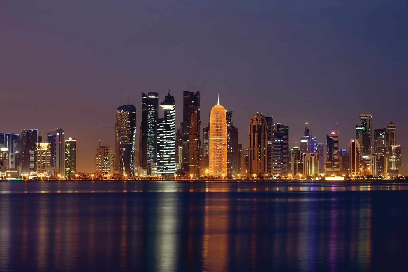 a cityscape of Doha by night